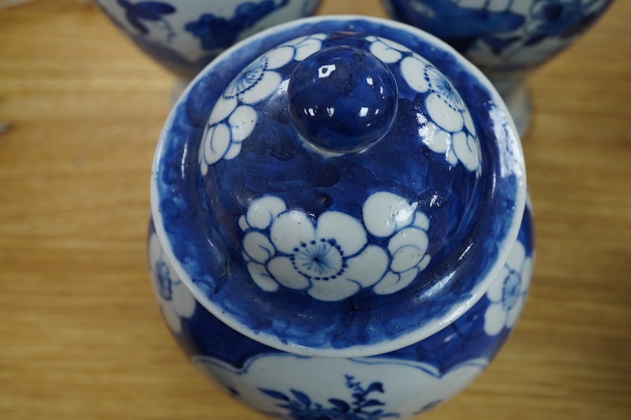 A pair of Chinese blue and white vases and a baluster jar and cover, largest 23cm high